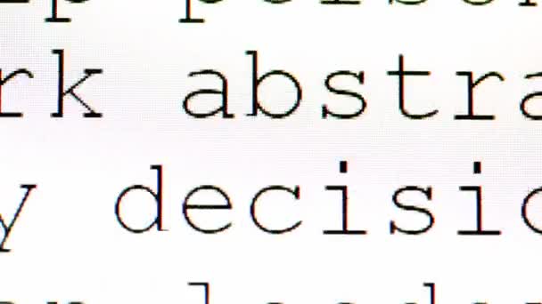 Texto preto se move na tela muito perto, de modo que apenas parte das palavras e algumas células de exibição são visíveis — Vídeo de Stock