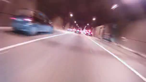 Cars enter into tunnel then leave on high-speed road — Stock Video