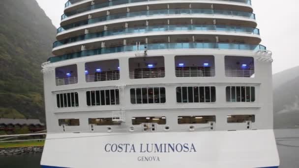 Feed of huge multideck Costa Luminosa liner standing at coast — Stock Video