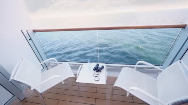 Fenced balcony of deck of ship for two with chairs and table — Stock Video