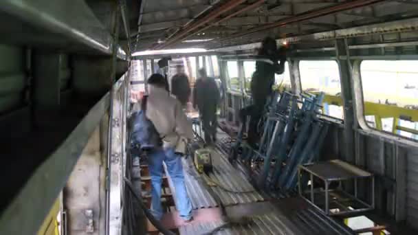 Workers weld iron walls in wagon at engineering plant — Stock Video