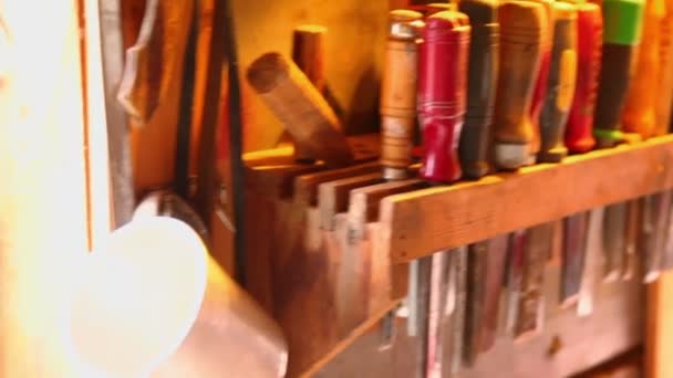 Lot of tools on shelve in workshop with mountains outside window — Stock Video