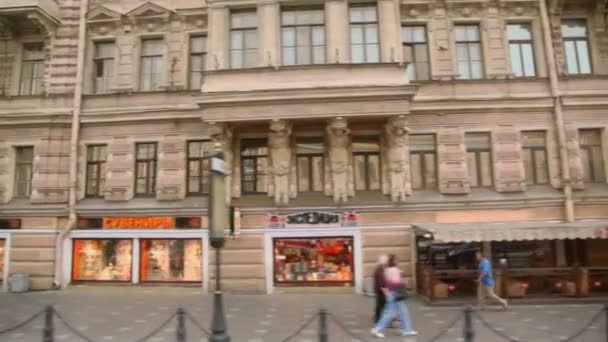 Several people walk by Nevsky avenue (view from bus) — Stock Video