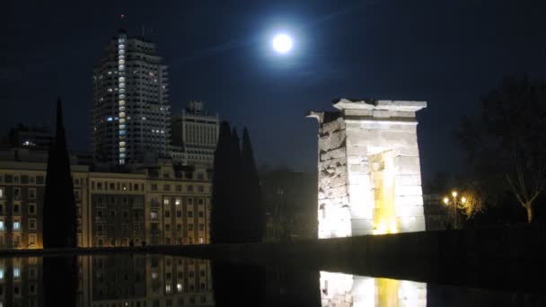 Temple Debot stands in moonlight beams against night sky — Stock Video