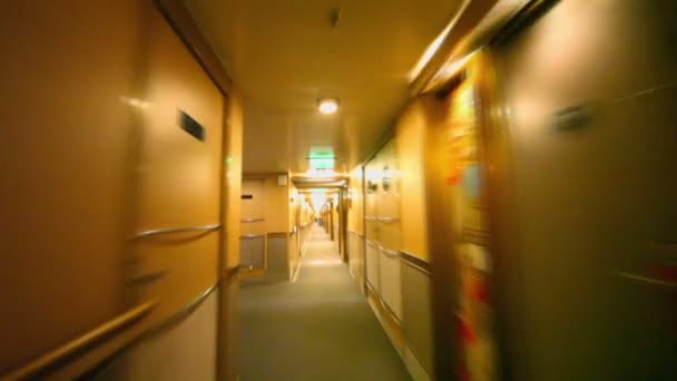 Motion through corridor with doors and lanterns on wall at ship — Stock Video