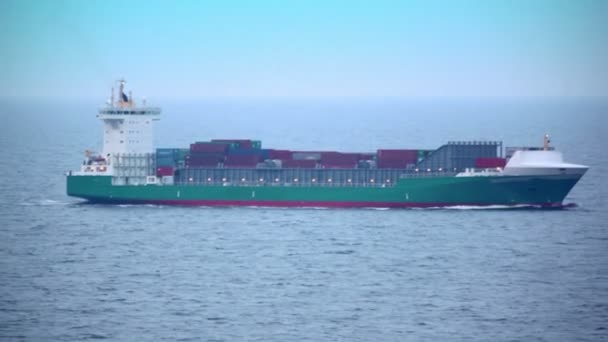 Barge floats in sea with many containers on deck — Wideo stockowe