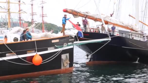 Sailingship moors to pier near other ships in port of Stavanger — Stock Video