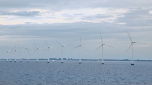 Several windmills for electric energy generation in sea — Stock Video