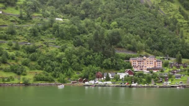 Car ride by mountain road from coastal village — Stock Video