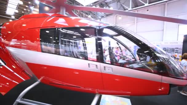 Swiss helicopter SKYe SH09 stands on International exhibition — Stock Video