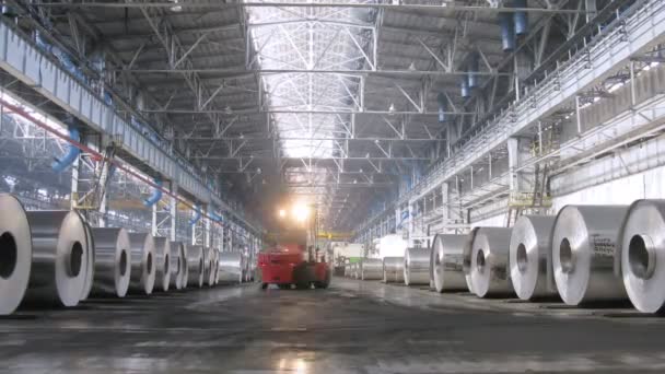 Loader distributes aluminum rolls in shop on rolling mill — Stock Video