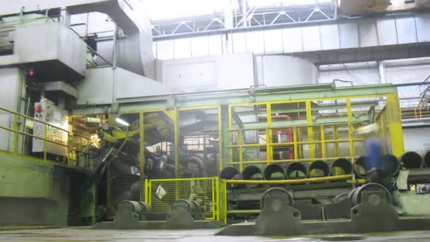 Loader lifts an roll of aluminum in production shop, time lapse — Stock Video