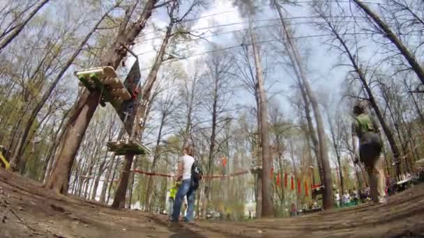 People participate in amusement ride in adventure park Panda — Stock Video