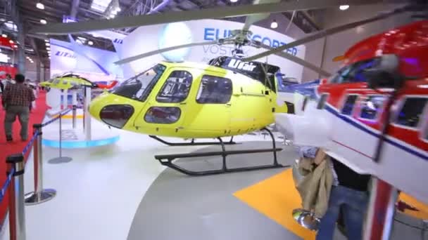 Helicopter UTair stands on International exhibition — Stock Video