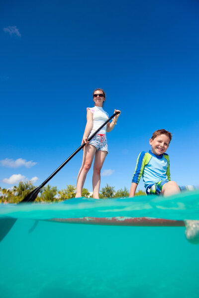 Mother and son on a paddle board