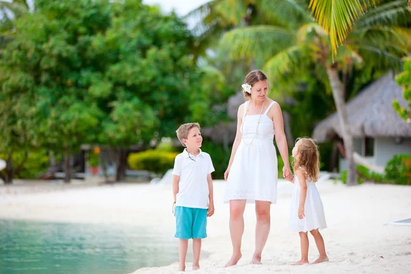 Mother and two kids at beach — Stock Photo, Image