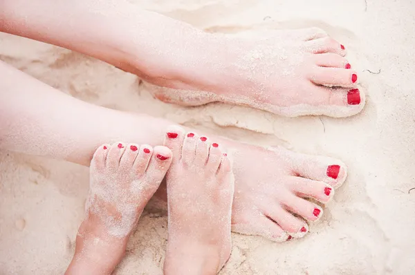 Feet on tropical sand — Stock Photo, Image