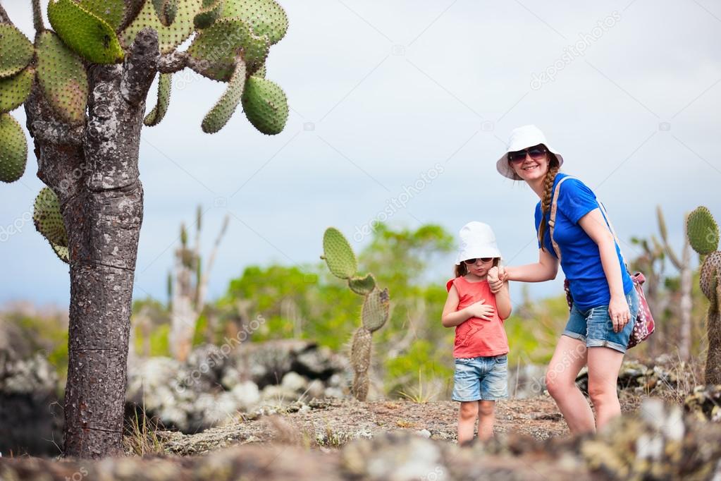 Mother and daughter hiking at Los Tuneles, Galapagos islands, Ecuador