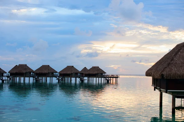 Over water villas at sunset — Stock Photo, Image