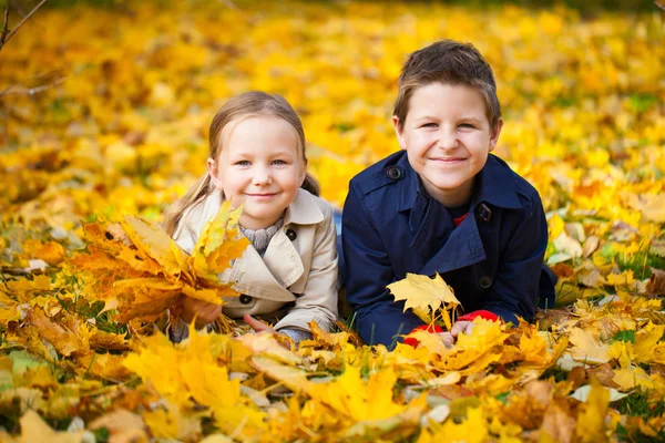 Little kids outdoors at autumn day — Stock Photo, Image