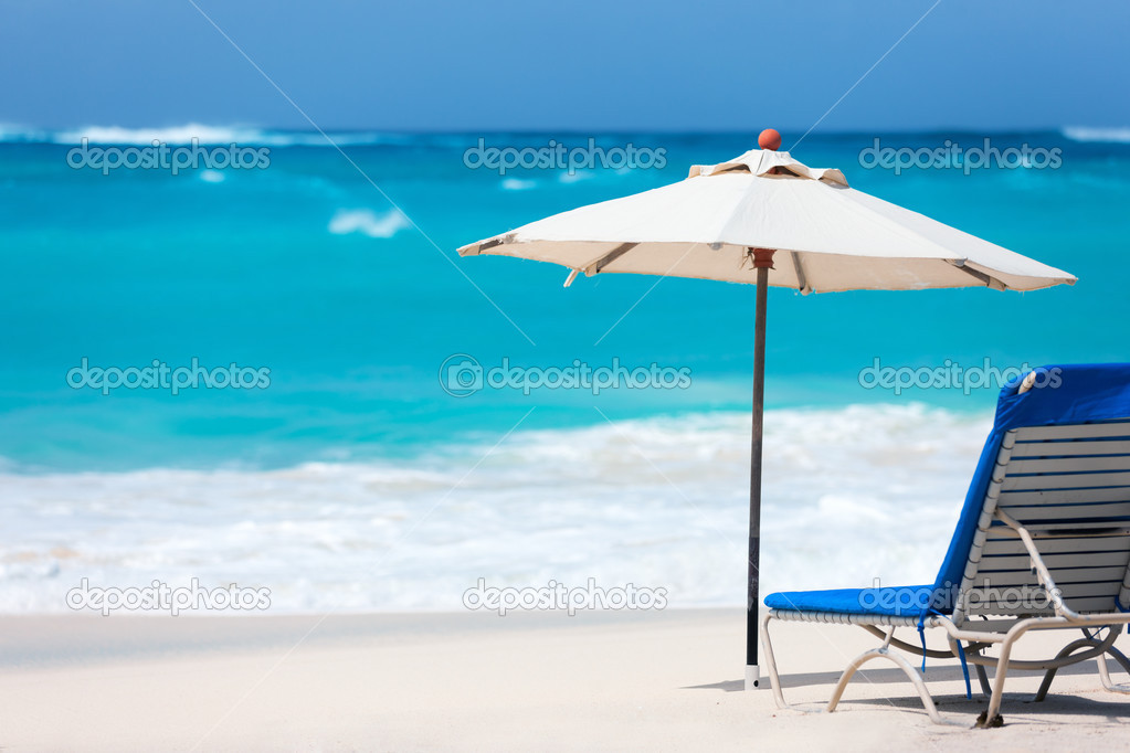 Chairs and umbrella on tropical beach