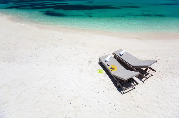 Lounge chairs on a beach — Stock Photo, Image