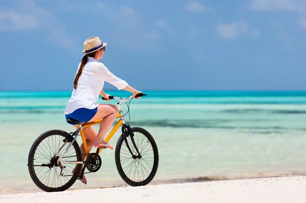Young woman biking Stock Image