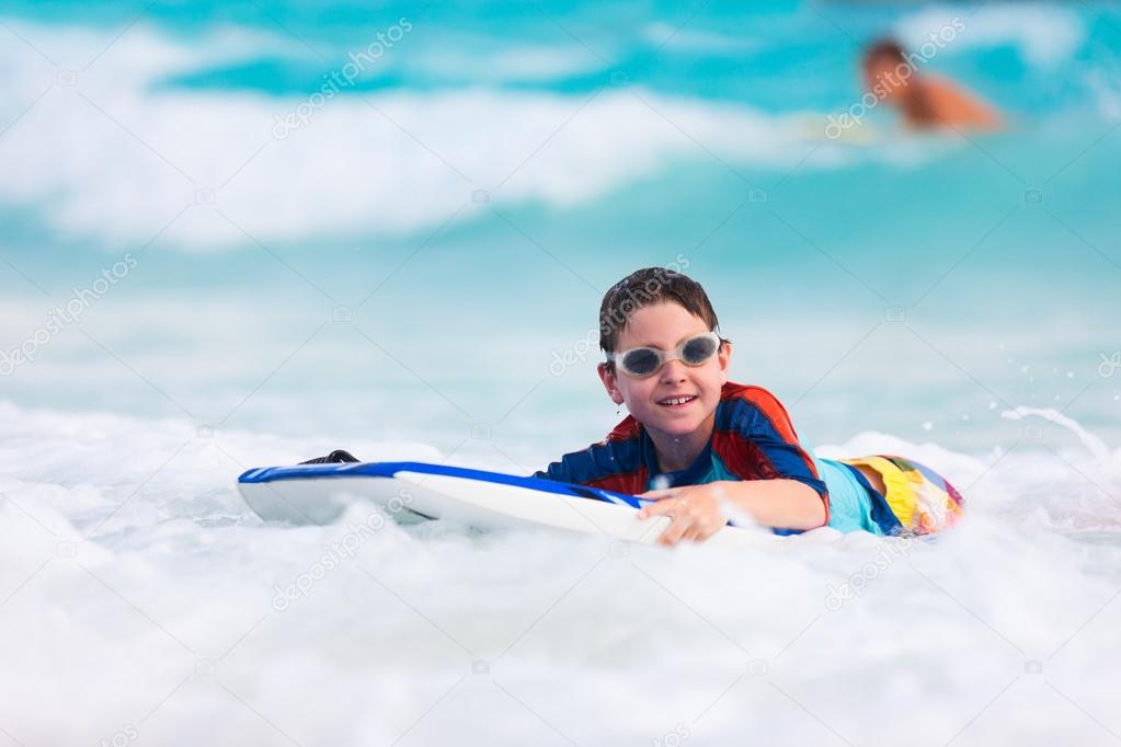 Boy swimming on boogie board