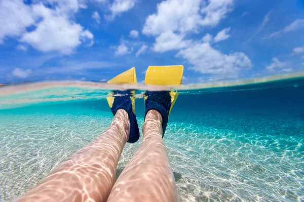 Split photo of  woman legs with fins — Stock Photo, Image