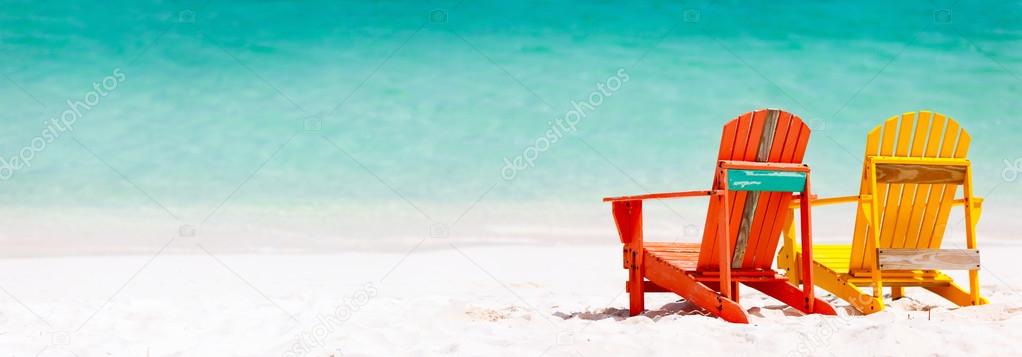 Colorful chairs on Caribbean beach