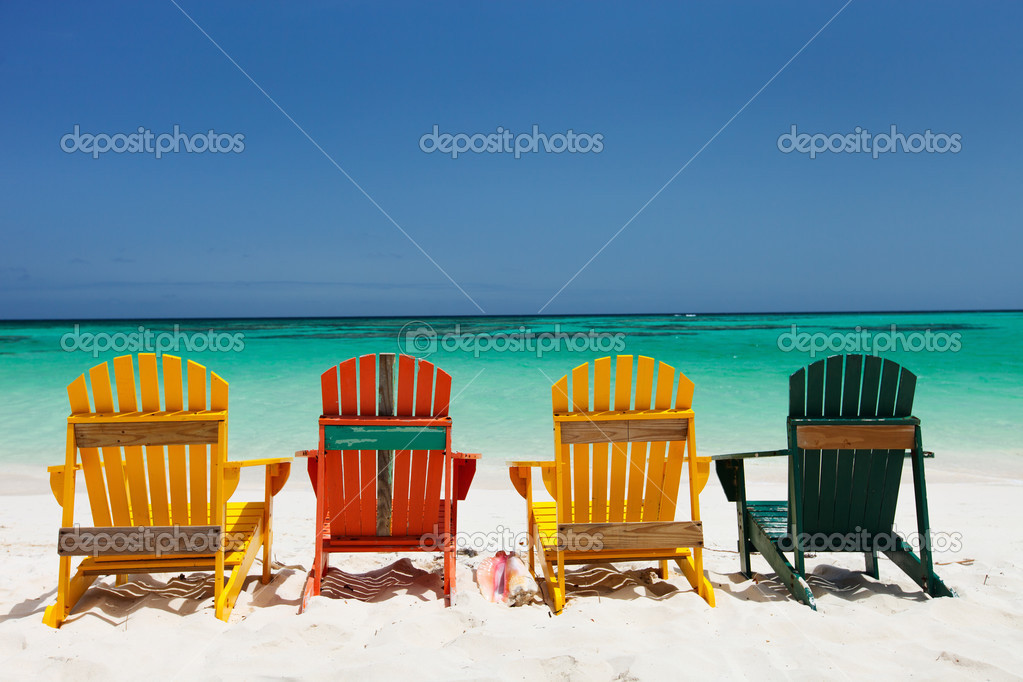 Colorful chairs on Caribbean beach