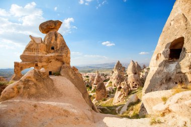View of rock formations and fairy chimneys near Uchisar castle in Cappadocia Turkey