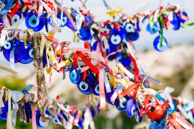 Evil eye charms hang from tree in Cappadocia Turkey for good luck