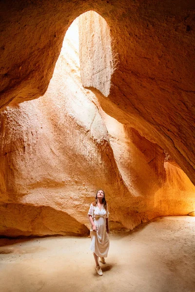 Young Woman Cave Sunbeams Shining Ceiling — Stok fotoğraf