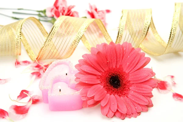 Pink flower and candles Royalty Free Stock Images