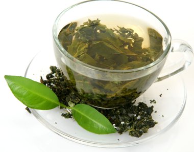 fincan çay ve bir yaprak yeşil