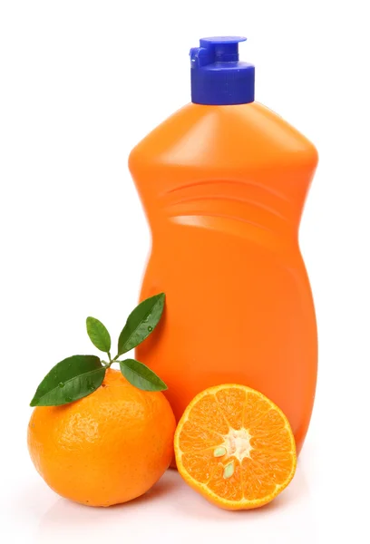 Bottle and the cut tangerine — Stock Photo, Image