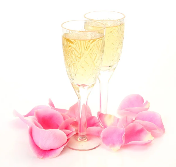 Champagne and petals of roses — Stock Photo, Image