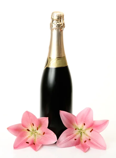 Champagne and pink lilies — Stock Photo, Image