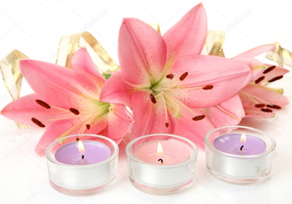 Pink lilies and candles — Stock Photo © Elena777 17850631