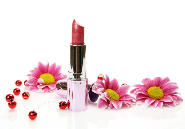 Pink flowers and lipstick — Stock Photo, Image