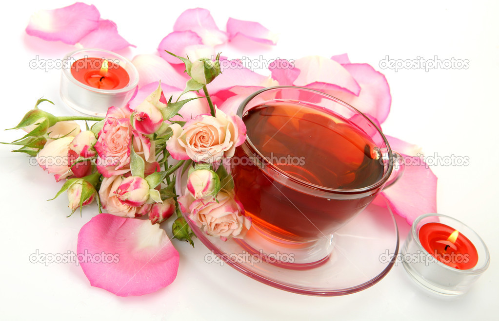 Tea and petals of pink roses