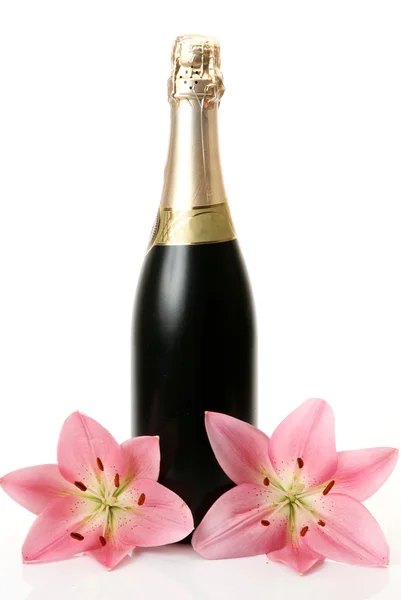 Champagne and pink lilies — Stock Photo, Image