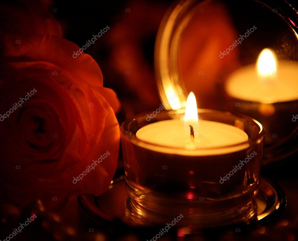 Rose and burning candle Stock Photo by ©Elena777 24236869
