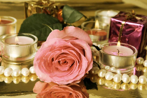 Pink rose and candles Stock Picture