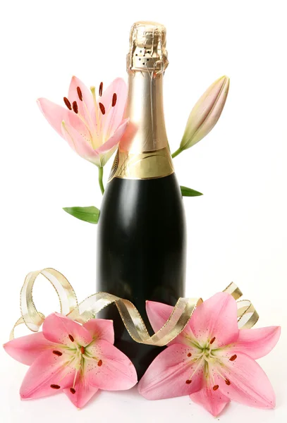 Champagne en roze lelies — Stockfoto