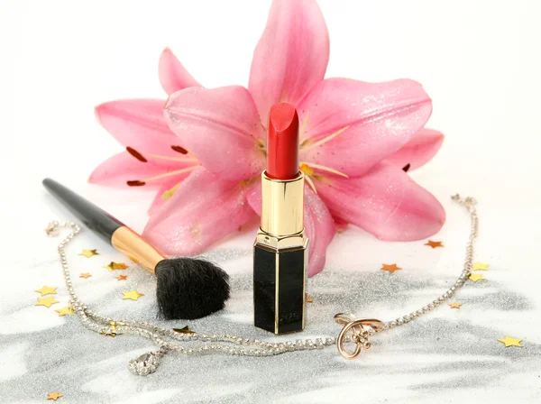 Pink lilies and lipstick — Stock Photo, Image