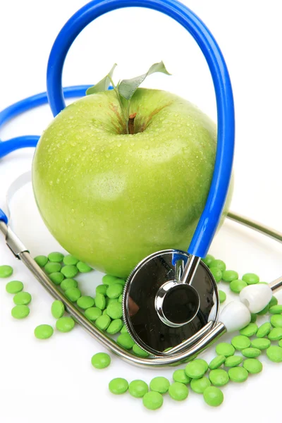 Apple, pills and stethoscope — Stock Photo, Image