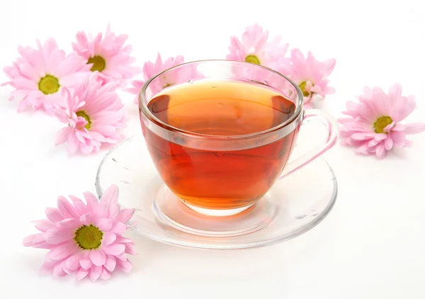 Tea and pink flowers — Stock Photo, Image