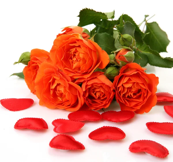 Fine roses and scarlet hearts — Stock Photo, Image